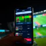 User interface of the OkXBet app displaying various betting options and live odds